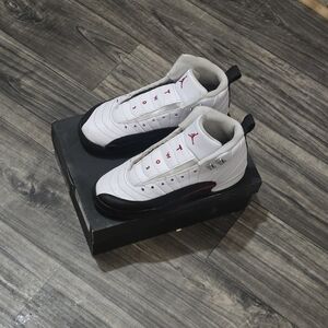 Air Jordan 12 Retro White and Black Sneakers with Red Accents